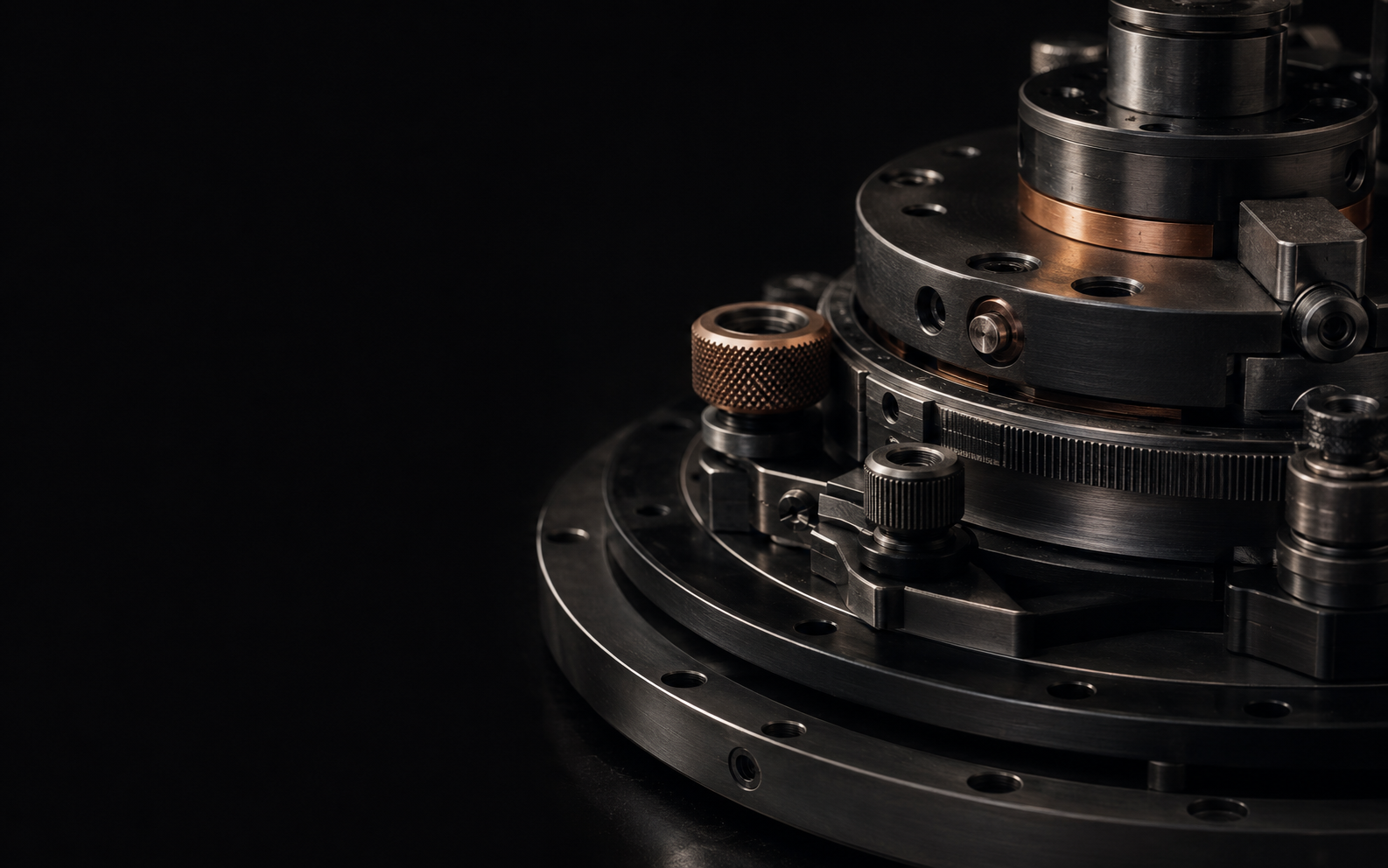 Precision-machined dark steel mechanism with copper details